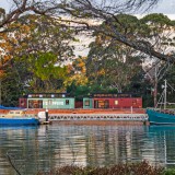 External view of the Coastal Pods Accommodation from the beautiful Inglis River, with local fishing and sailing boats in the foreground.